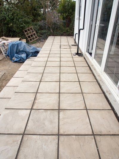 Clean paver patio after pressure washing